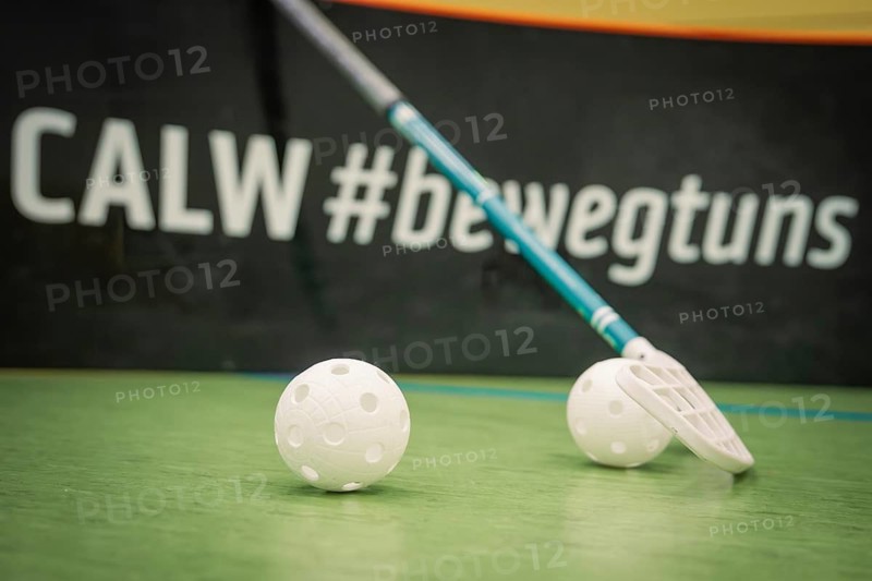 Floorball rackets and balls in front of an advertising gang in a hall, Foolball, Calw, Germany