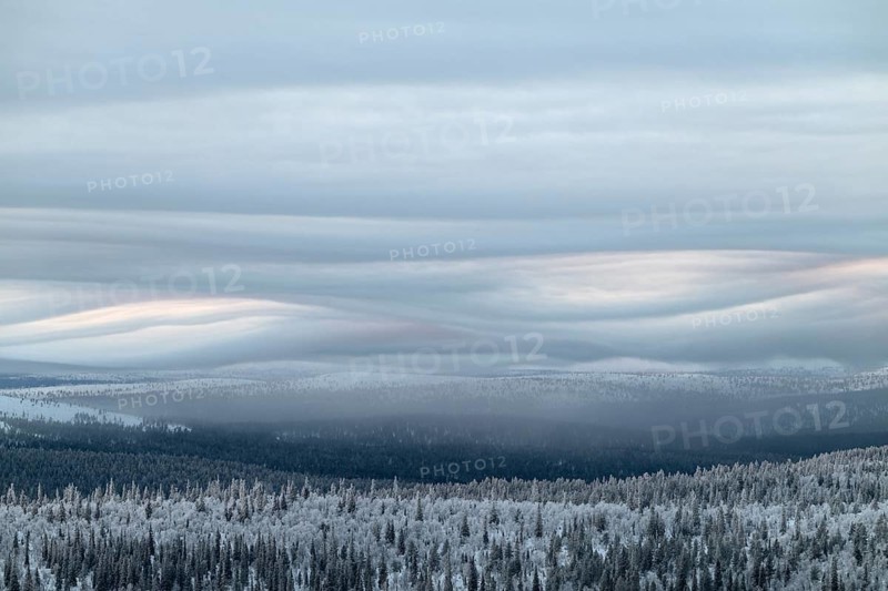 Clouds over forested mountain ranges, Saariselkä, Lapland, Finland, January 2025