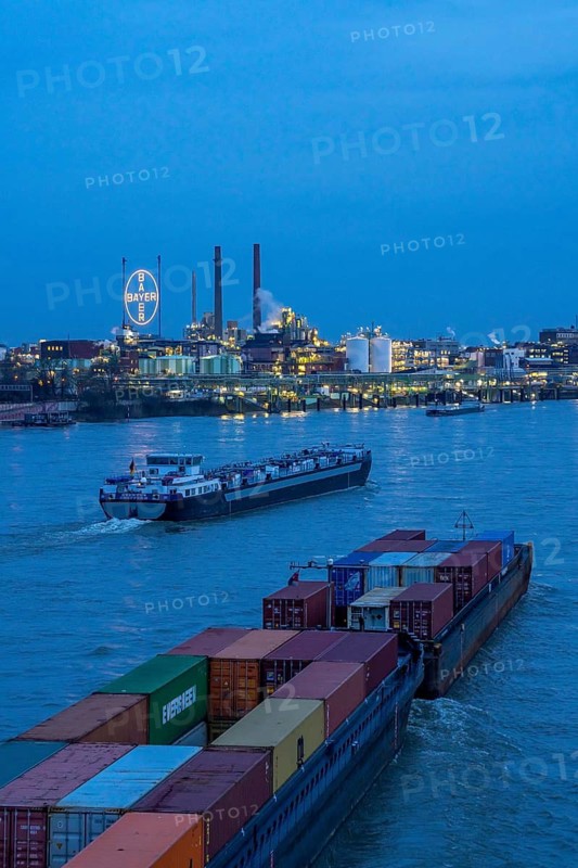Backdrop of Chempark Leverkusen, Bayer Leverkusen, chemical park, chemical plant, river Rhine, cargo ship, Leverkusen, North Rhine-Westphalia, Germany