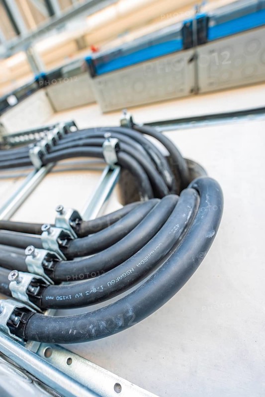 Close-up of curved cables in an electrical system, electrical system for PV system, industrial customer, Mühlacker, Germany