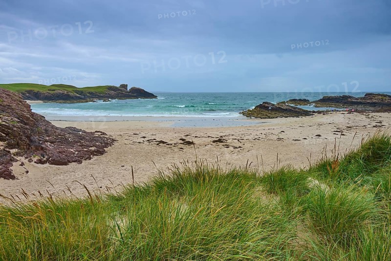 Beach with wavy sea surrounded by rocky headlands and grass, Clachtoll Beach, Clachtoll, Lairg, Scotland, United Kingdom, Great Britain