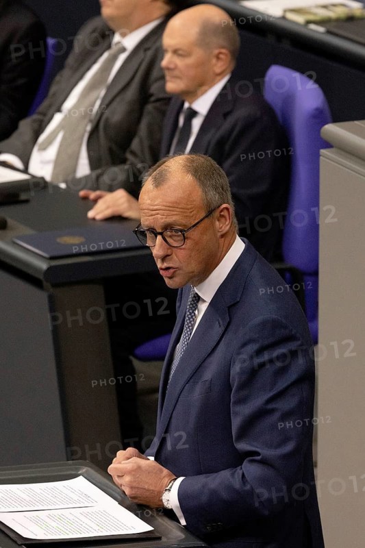 Olaf Scholz (Chancellor of the Federal Republic of Germany, SPD) and Friedrich Merz (Federal Chairman of the CDU) during the government statement on the current situation in the Bundestag on 13 November 2024