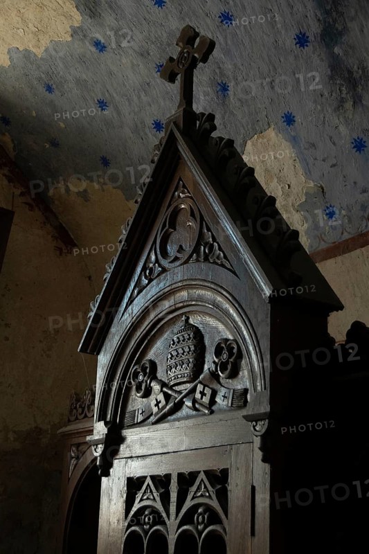Wooden confessional inside a churchl in Auvergne. France