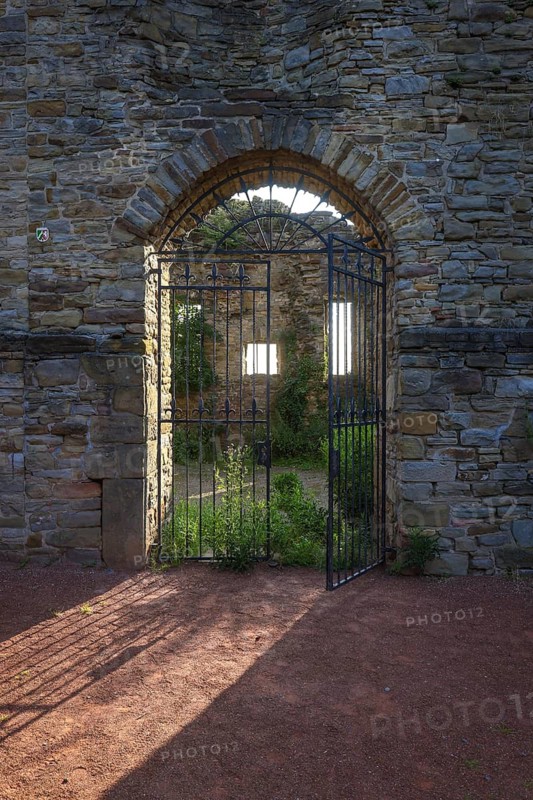 Wetter an der Ruhr, North Rhine-Westphalia, Germany - Wetter Castle in the historic old town centre of Wetter an der Ruhr. Entrance gate backlit