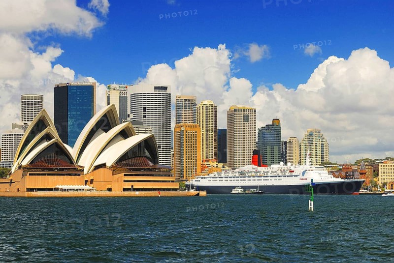Sydney Opera with luxury liner Queen Elizabeth 2 and skyscrapers, Sydney Cove, Sydney, New South Wales, Australia Sydney, New South Wales, Australia