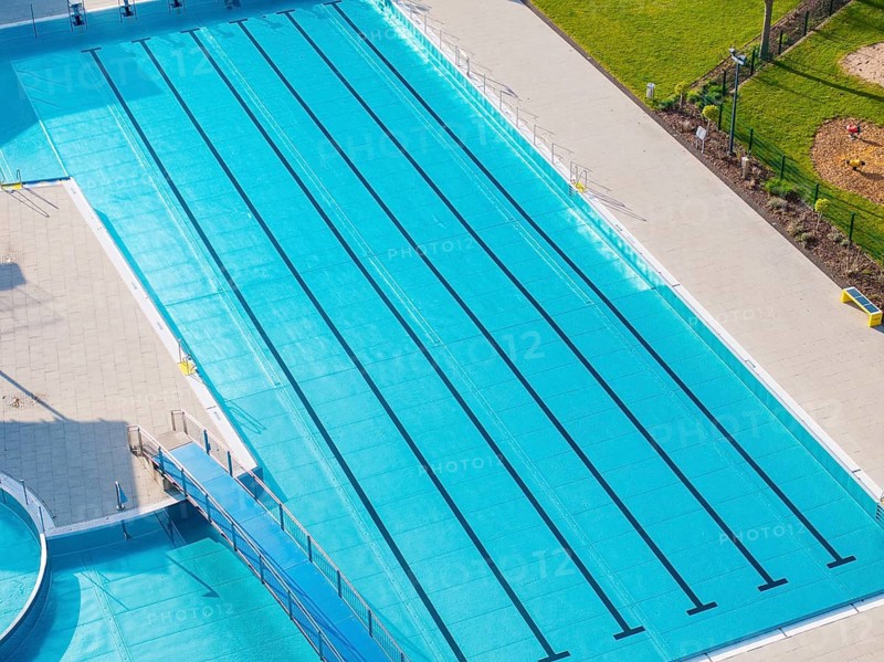 Large outdoor pool with marked swimming lanes and light blue water surface, Calw Stammheim outdoor pool, Calw, Black Forest, Germany