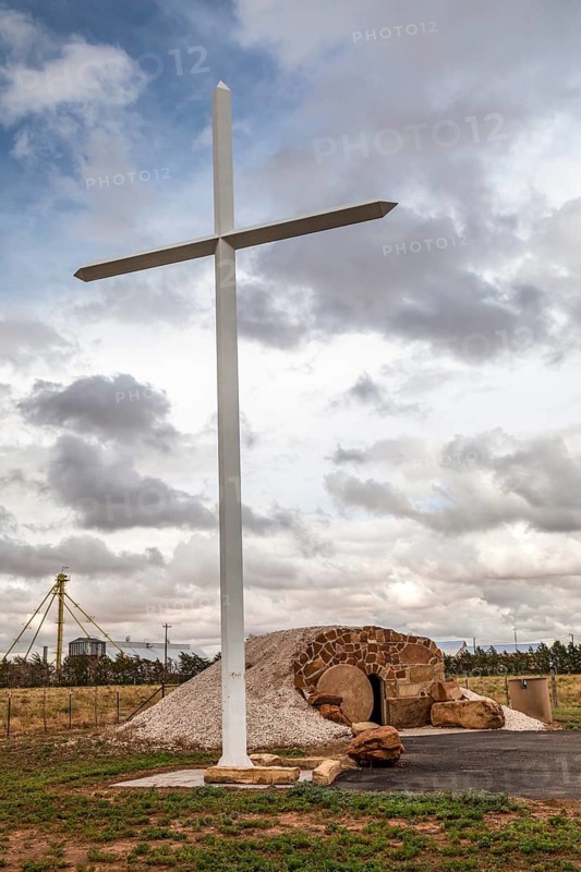 Brownfield, Texas, The Highway 380 Cross and Tomb, a Christian roadside shrine in west Texas. The tomb is open, with an inscription reading He Is Risen.