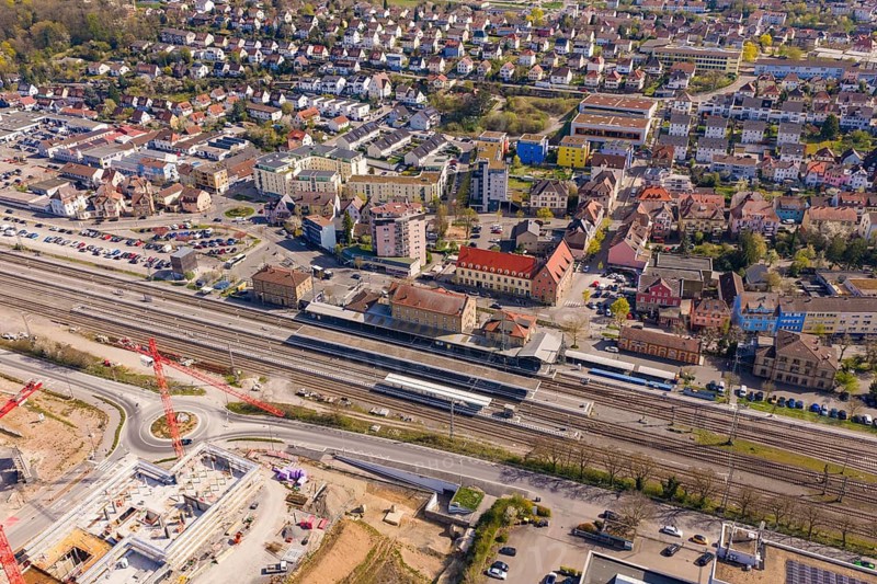 Urban area with train stations and residential areas, surrounded by traffic routes, PV plant at Obi Baumarkt, Mühlacker, Enzkreis, Germany