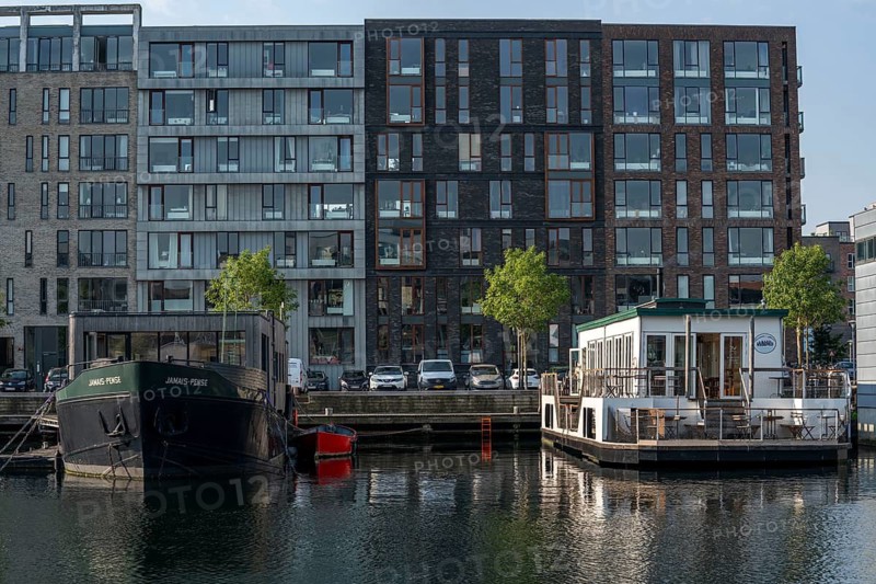 Sluseholmen neighbourhood, on an artificial island, houseboat, former industrial area, now a new residential area, with many canals, waterfront living, Copenhagen, Denmark