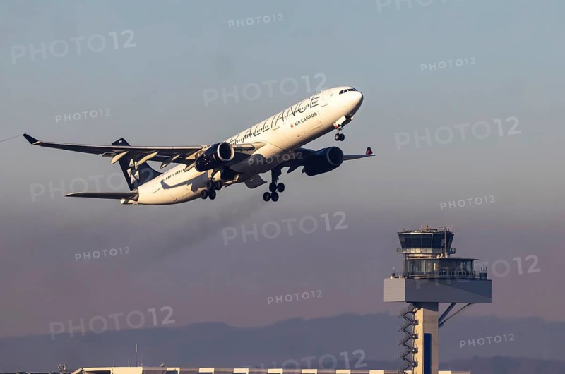 Aircraft climbing in front of the tower, take-off at Fraport Airport. Aircraft registration: C-GEGP, Air Canada, Airbus A330. Frankfurt am Main, Hesse, Germany