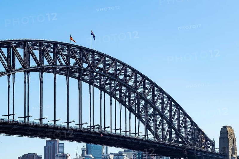 The Australian and Aboriginal flags fly from the arch of the Sydney Harbour Bridge in Sydney, Australia