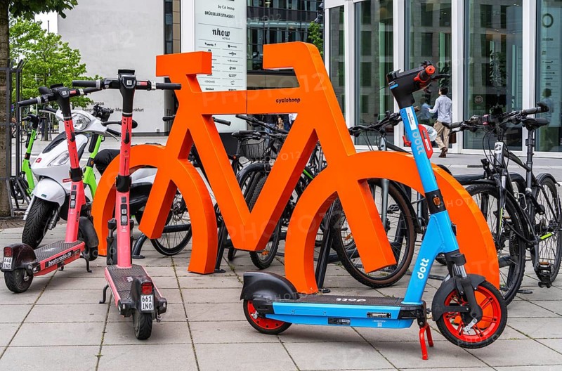 Bicycle symbol in orange for a bicycle parking space in front of Office Building One on Brüsseler Straße, Frankfurt am Main, Hesse, Germany