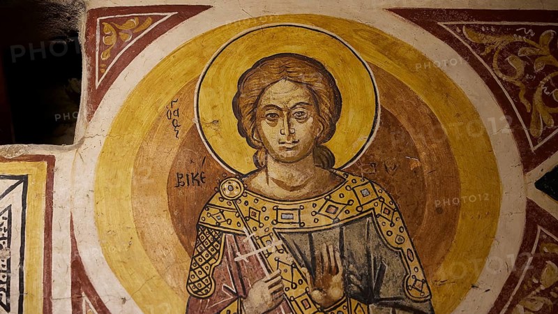 Depiction of a holy figure with book and halo on church wall, Thari Monastery, Moni Thari, near Gadouras Reservoir, lonely mountain region, Rhodes, Dodecanese, Greek Islands, Greece