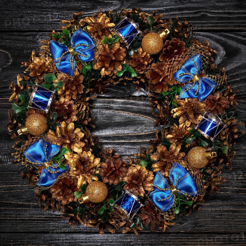 Christmas wreath on dark wooden background