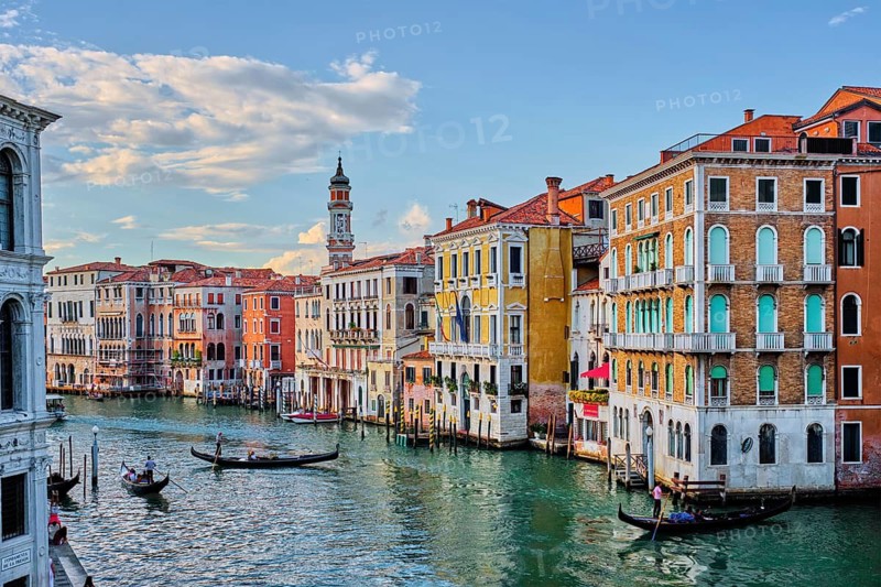 VENICE, ITALY, JUNE 27, 2018: Grand Canal with boats and gondolas on sunset, Venice, Italy