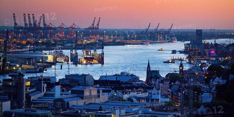 View of the Norderelbe and the harbour from the St. Nikolai memorial during an atmospheric sunset, Hamburg, Germany