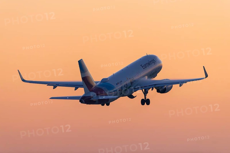 Passenger aircraft after take-off, in front of sunrise, Eurowings, Baden-Württemberg, Germany
