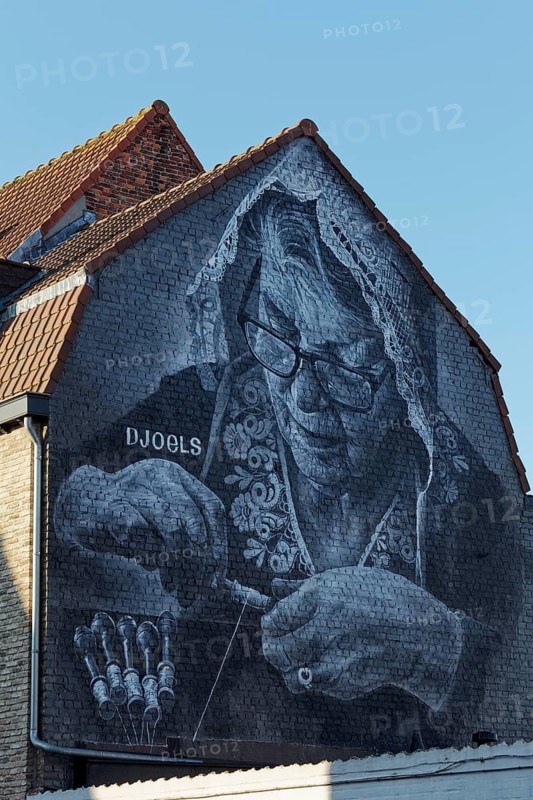 Mural lace maker with traditional lace bonnet, realistic mural in black and white by street artist Djoels, Bruges, West Flanders, Flanders, Belgium