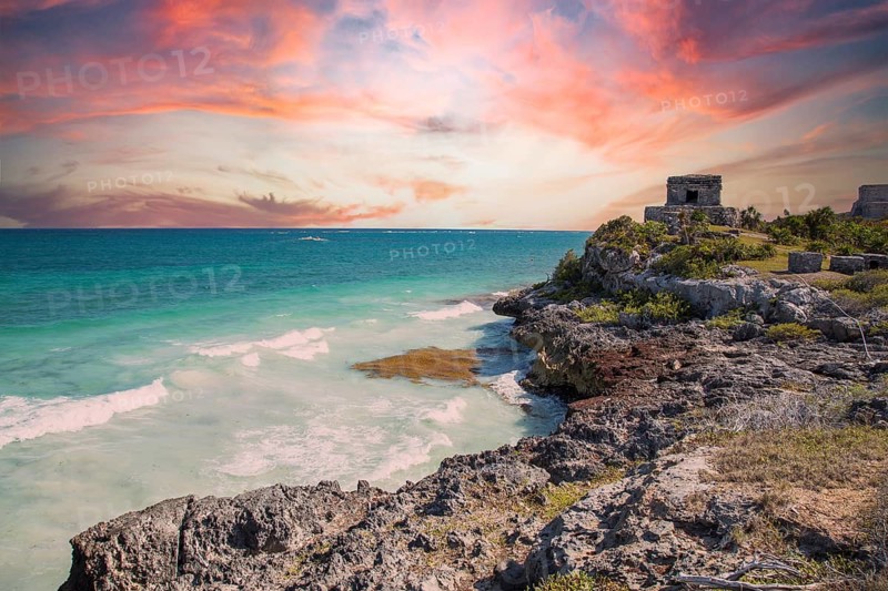 Sunset at the sea next to the Mayan temples of Tulum in Mexico
