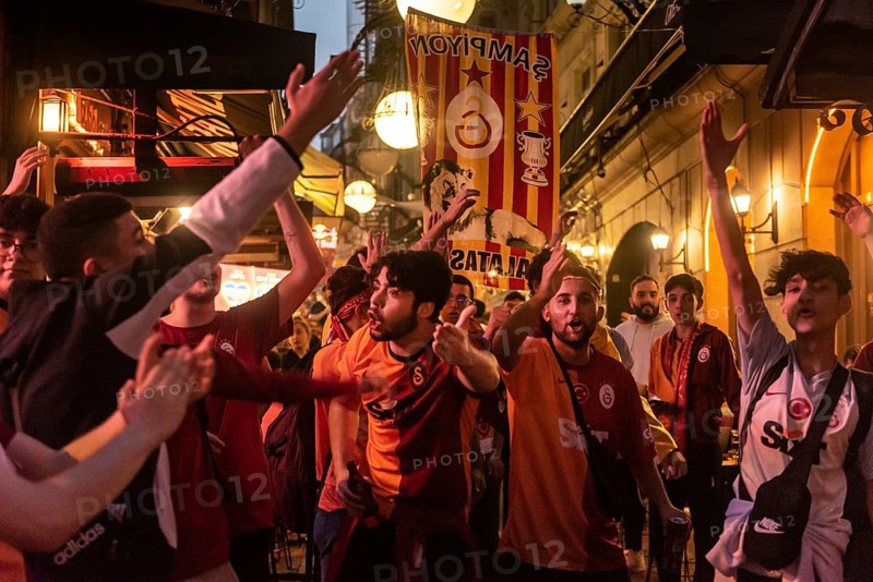 Istanbul, Turkey. October 24th 2023 Galatasaray football fans singing and chanting songs before the Champions League match against FC Bayern Munich. Nevezade near Istiklal Street, Taksim, Istanbul, Turkey