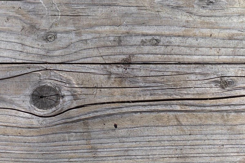 Old wooden gray-brown texture of the board in the park