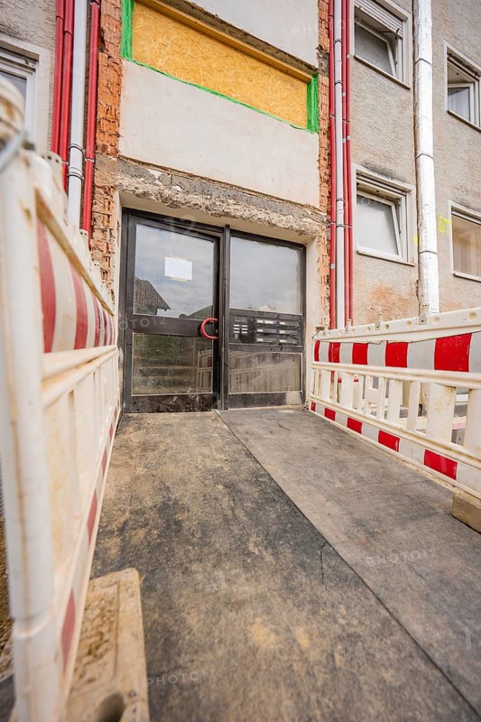 Entrance to a building in the renovation process with barriers, residential renovation, Nagold, Calw district, Germany