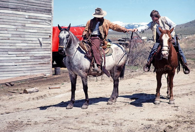 Nevada City historic ghost town, Montana, USA two cowboys on horses