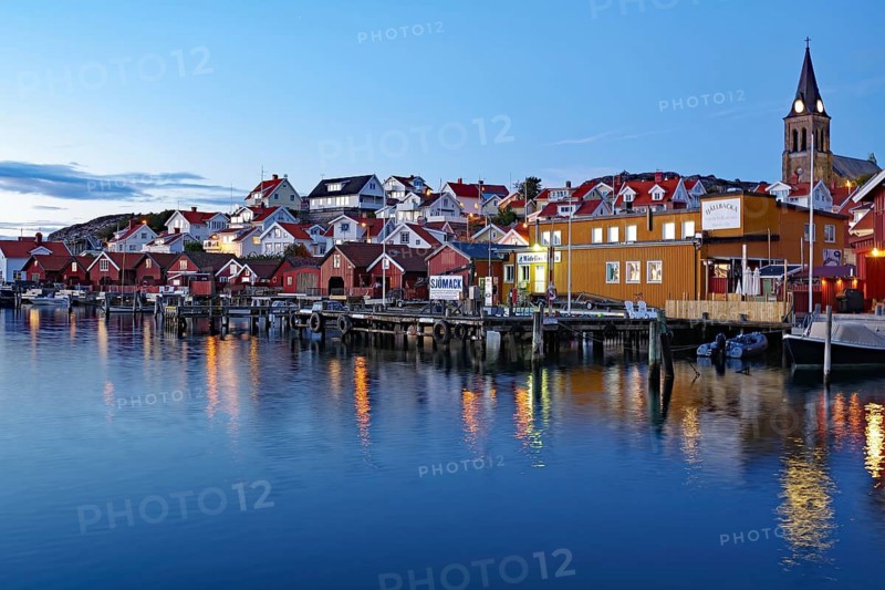 Harbour and small wooden houses in autumn evening light, blue hour, silence, tranquillity, Fjällbacka, Bohuslän, Sweden