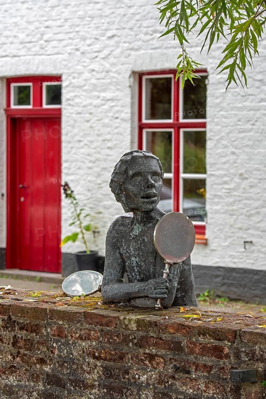 Sculpture group about Till Eulenspiegel, Tijl Uilenspiegel, German folk hero made by Jef Claerhout in the city Damme, West Flanders, Belgium