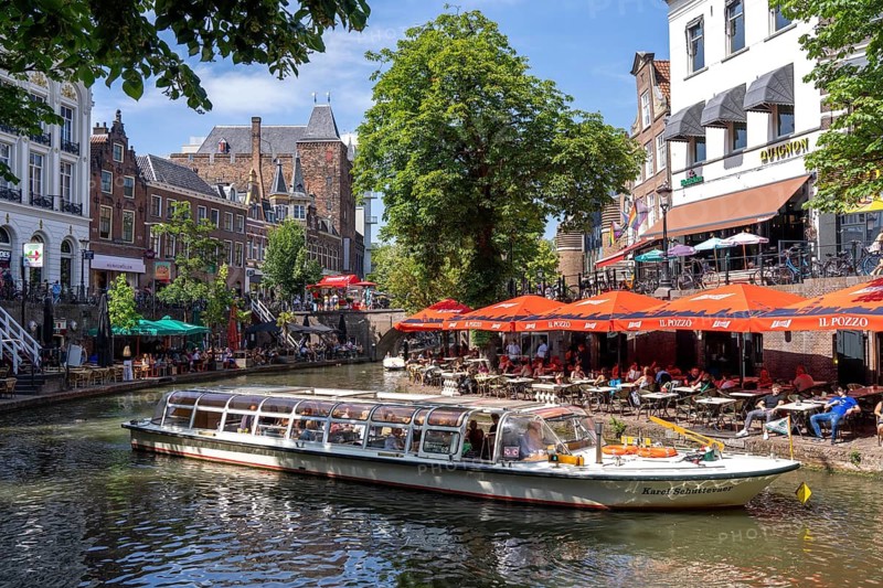 The old town centre of Utrecht, Oudegracht, around 2 km long with many old houses, shops, restaurants directly on the canal, many bridges, boat traffic of all kinds, canal cruise, Netherlands