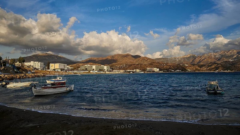 Coastal town with boats in the foreground and mountains in the background, Pigadia, town and harbour, boats, hotels, Pigadia Bay, main town, Karpathos, Dodecanese, Greek Islands, Greece