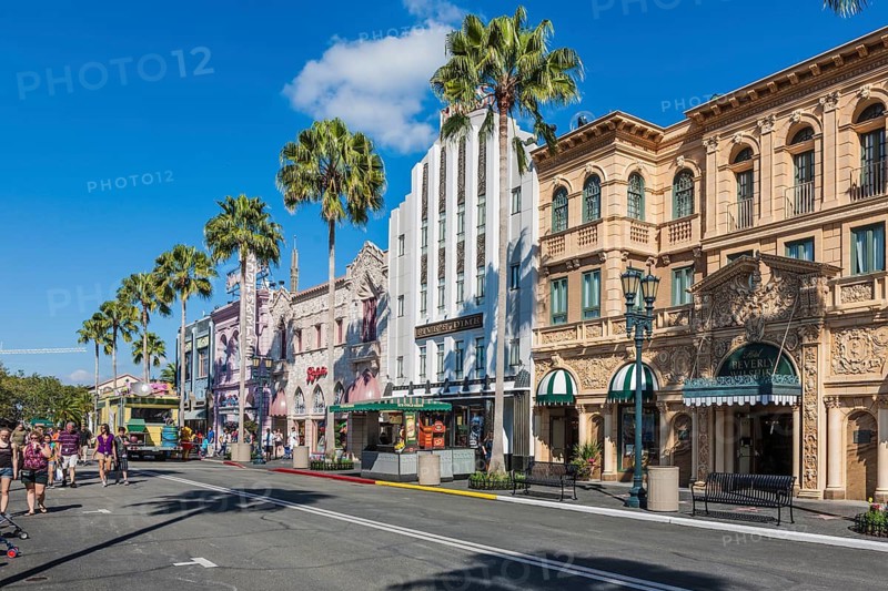 Tourists walk along Rodeo Drive in the Hollywood area of Universal Studios theme park in Orlando, Florida, USA