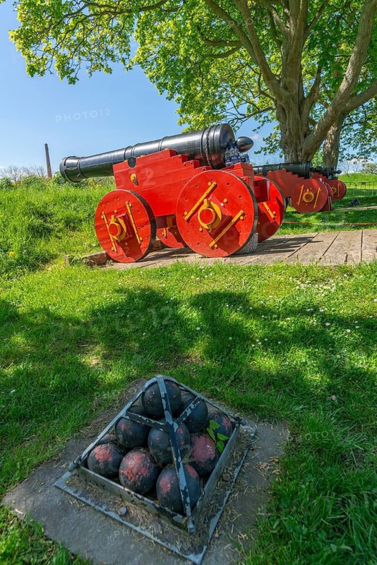 Nyborg Castle, medieval fortress with moat and ramparts, brick building, historic cannons with red wooden wheels, cannonballs, Fyn, island of Funen, Denmark, Fy, Funen, Denmark