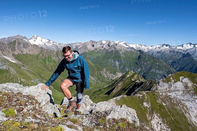 Mountaineer in front of mountain panorama with Großvenediger, mountain landscape with mountain peaks of the Venediger group, view from the summit of the Gösleswand, Lasörling group, Hohe Tauern National Park, East Tyrol, Tyrol, Austria