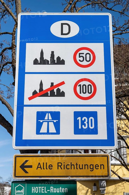 Information board on general speed limits in Germany for cars and motorcycles following a border crossing to the Federal Republic of Germany