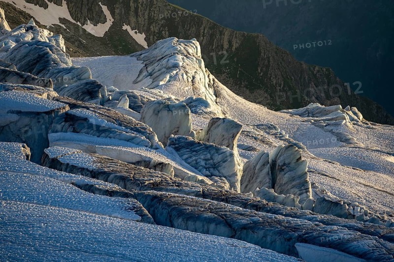 Glacier ice with crevasses in the evening light, Glacier du Tour at sunset, High alpine mountain landscape, Chamonix, Haute-Savoie, France