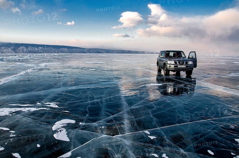 Car on the ice, Lake Baikal, Olkhon Island, Pribaikalsky National Park, Irkutsk Province, Siberia, Russia