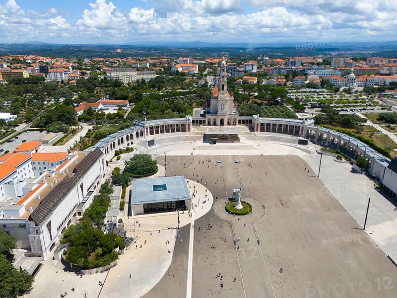 Wide view of a city with basilica and large square, many people, blue sky and clouds, aerial view, Basilica of Our Lady of the Rosary, Santuario de Fatima, place of pilgrimage, Fatima, Fátima, Ourem, Santarem, Portugal