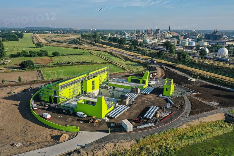 Oberhausen, North Rhine-Westphalia, Germany - Emscher conversion, new Emscher AKE sewer, here the new Oberhausen pumping station, Germany's largest wastewater pumping station, with 10 pumps pumping up to 16, 500 litres of wastewater per second from a depth of around 40 metres. At the back left, new floodplains for better flood protection. Back right OQ Chemicals plant Ruhrchemie. The ecological conversion of the Emscher system consists of the construction of a central wastewater treatment system in the Ruhr area, the construction of sewers and the renaturalisation of the Emscher and its tributaries