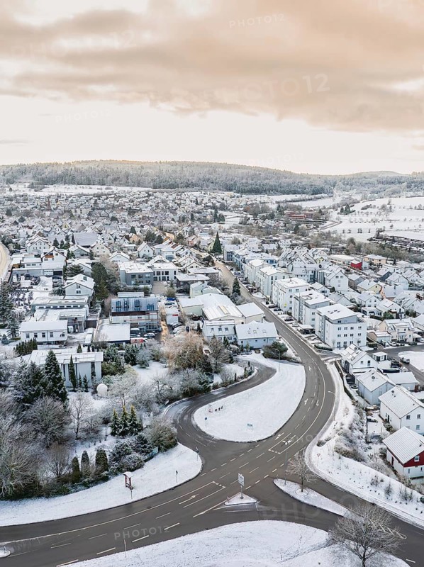 Snowy village with geometric streets and surrounding hills, Calw- Stammheim, Black Forest, Germany