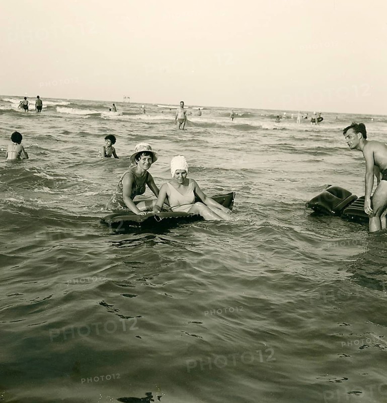 Historical photo summer 1961, tourists, beach, Rimini, Italy
