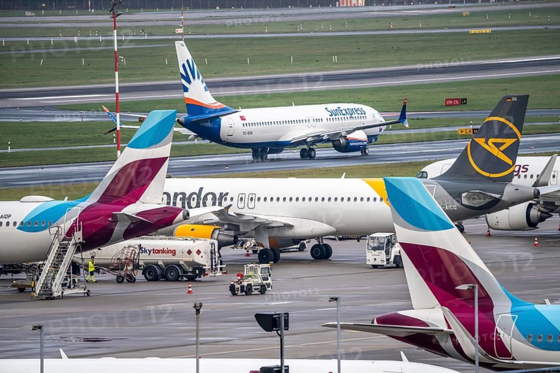Düsseldorf Airport, Eurowings aircraft on the apron, Sunexpress Boeing 737 on the taxiway for take-off, Düsseldorf, North Rhine-Westphalia, Germany