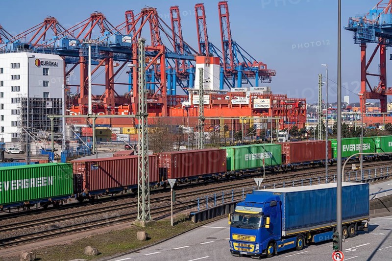 Port of Hamburg, Waltershofer Hafen, container ships, goods train with containers and container lorries bring and collect freight containers to and from HHLA Container Terminal Burchardkai, Hamburg, Germany