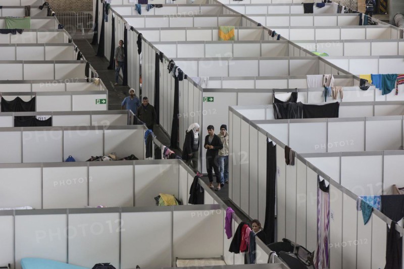 Temporary rooms with beds are set up in an emergency shelter for refugees on 9 December 2015 in a former hangar at Tempelhof Airport, Berlin, Berlin, Germany