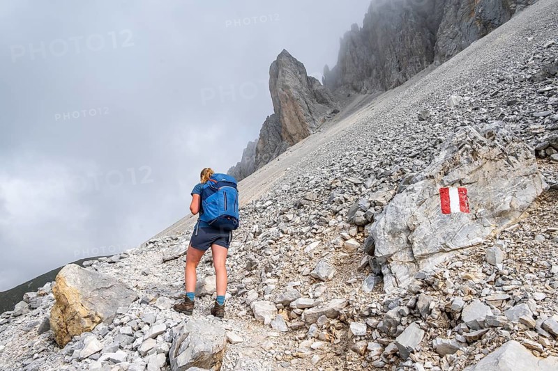 Hiker on the ascent to the Great Kinigat, Carnic Main Ridge, Carnic High Trail, Carnic Alps, Carinthia, Austria