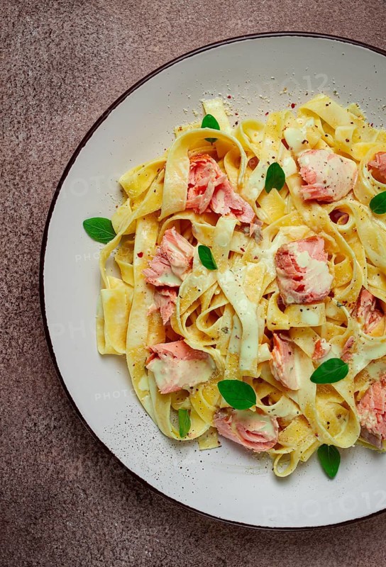 Tagliatelle pasta, in cream sauce with salmon, homemade, no people