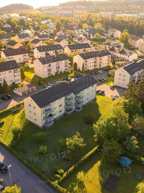 View of housing estate with apartment buildings and autumnal greenery, Calw, Black Forest, Germany