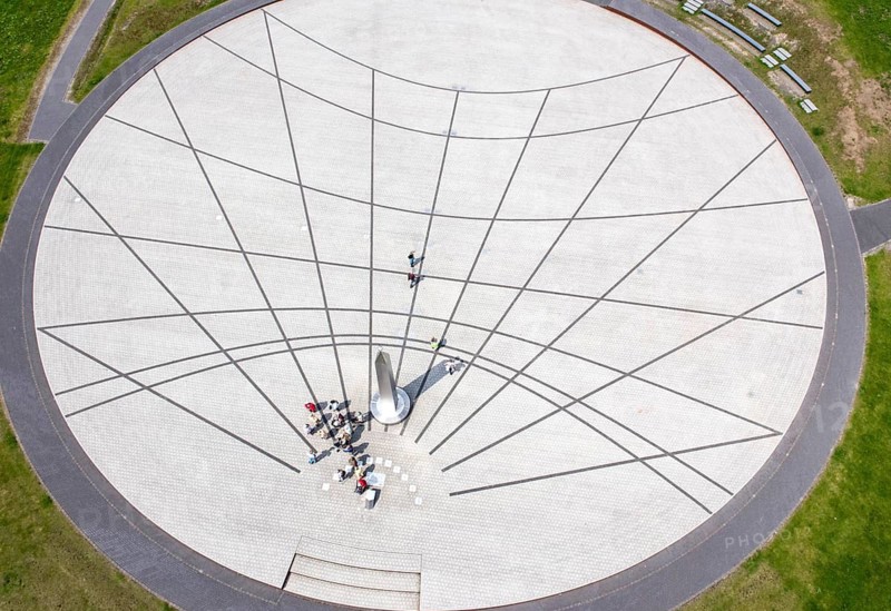Herten, DEU, 05.06.13 JE - Visitors look at an obelisk on a large sundial in the Hoheward Landscape Park, created on a former heap of the Ewald mine in Herten. The approximately 3, 000 m² horizontal sundial is located on the southern plateau at an altitude of around 140 meters. Since the beginning of 2011, the landscape park has been part of the Route of Industrial Heritage