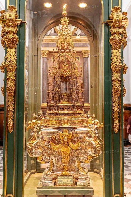 Magnificent golden reliquary behind glass, richly decorated and detailed, Cordoba
