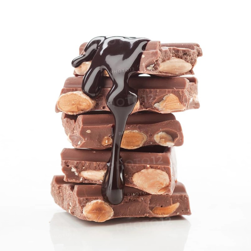 A stack of chocolate bars with almonds, covered in rich, glossy melted chocolate, against a white background. Perfect for illustrating indulgent desserts or sweet cravings